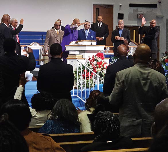 Pastor Scott delivers moving message during memorial service.