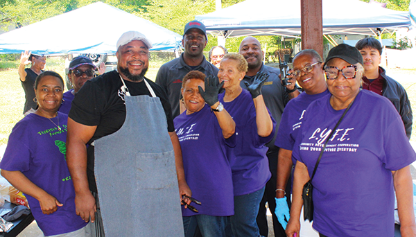Pastor Jones, congregants, first responders and community members smile