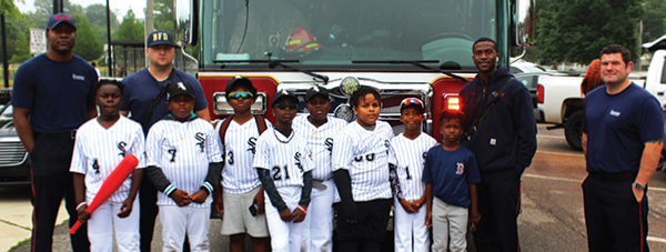 Jefferson County Baseball Little League players pose alongside Bessemer’s Fire Department personnel