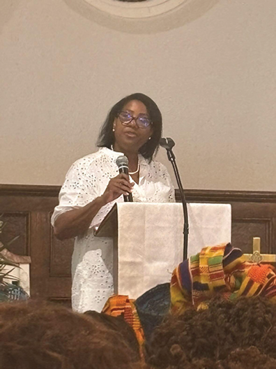 Hamilton Hood Founder, Yamona Pierce addresses audience at Juneteenth program.
