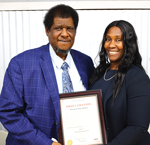 Lipscomb acting Mayor, Monique Wilkerson, presents Pastor Bonner a proclamation.