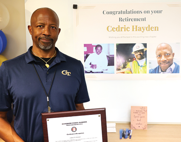 Mr. Hayden poses with certificate of recognition