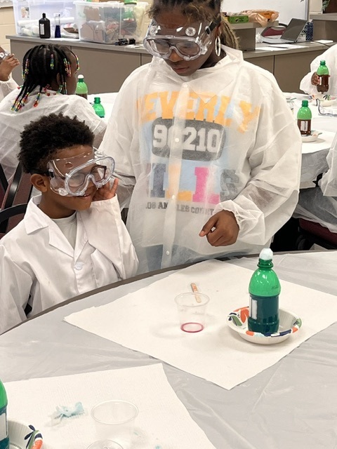 Two scholars at work on an experiment during Planting Seeds in the Black Belt.