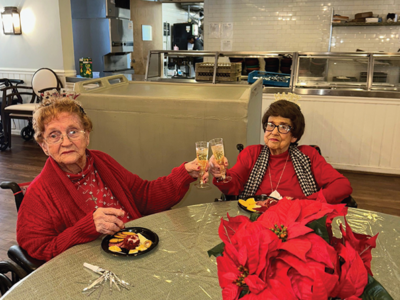 Ella Hill and Eloise Davis at Plantation Manor toasting the New Year