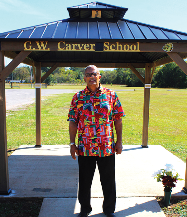 Dr. Fears poses before Carver School