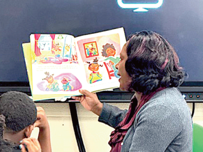 Chamber President Latasha Williams with students