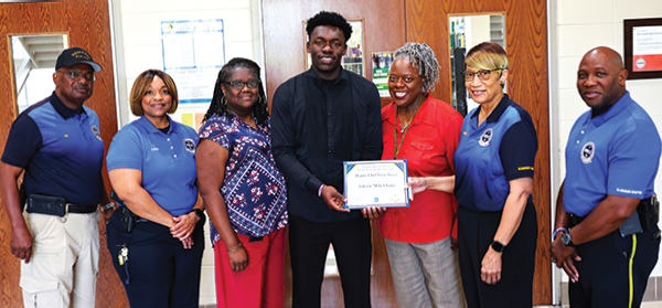 NOBLE members pose with student JaKyrie M. Chaney (above)