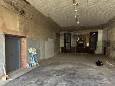 Workers opened a passage through the two-foot-thick brick wall that had separated the Opera House from its west-side space, known locally as Phillips II, since 1903.