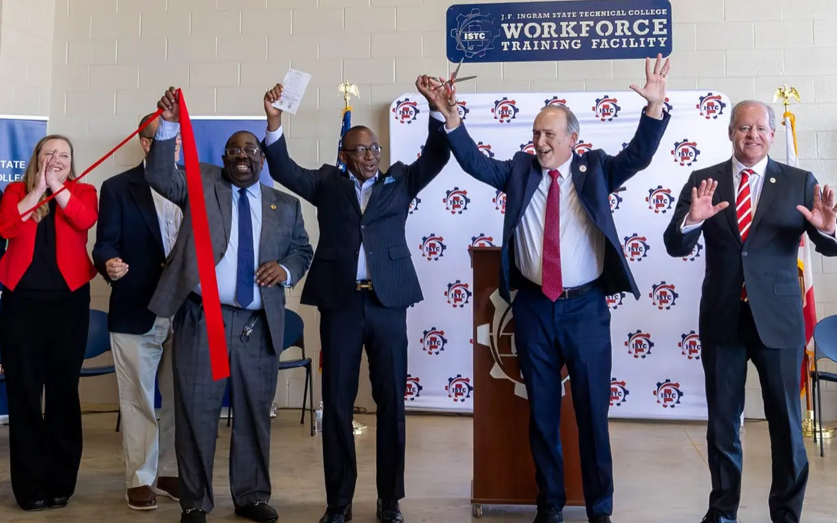 Officials raise the ribbon at the new J.F. Ingram State Technical College workforce training facility at the Perry County PREP Center on Sept. 23.(above)